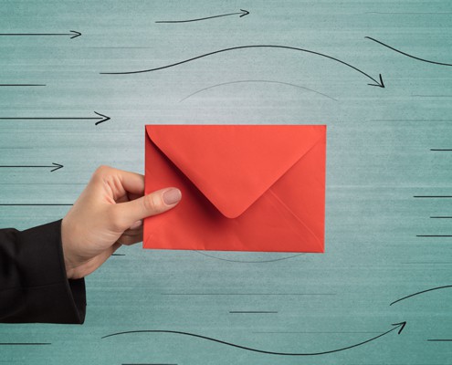 Man holding a red envelop