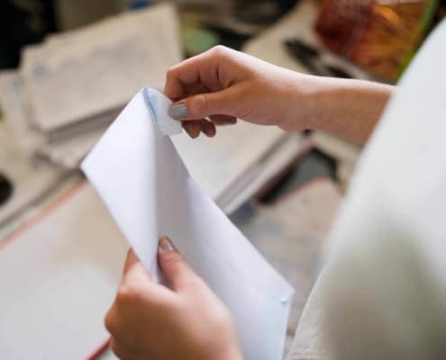 Woman opening an envelop