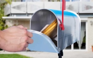 Person opening their mailbox