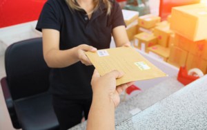 Close up view of a person receiving a letter