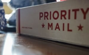 Close up of a priority mail box on desk