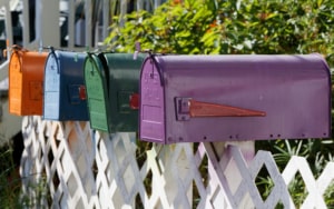 Side view of multi colored mail boxes