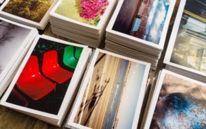 Stacks of various colored postcards