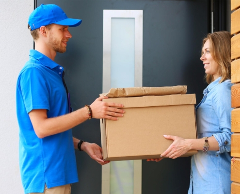 A person receiving a package at their home.